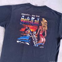 Full back view of black T-shirt showing complete Soft-Tail graphic and text