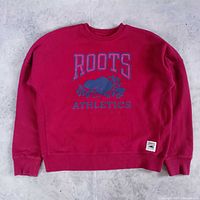 Front view of red Roots Athletics Canada t-shirt