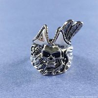 Front view of silver-plated pirate skull ring showing skull face and hat detail