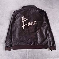 Back view showing white “The Fonz” graphic and overall condition
