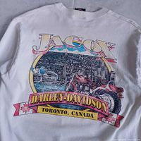Close-up of back print with Jacox, Toronto skyline, motorcycle and Harley ribbon