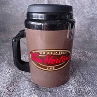 Front view showing Tim Hortons Toujours Frais logo and handle