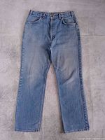 Front view of Levi’s 619 jeans laid flat