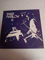 Front cover of Barry Manilow II LP showing overall artwork and wear