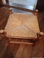 Top view of square rush-seat wooden foot stool