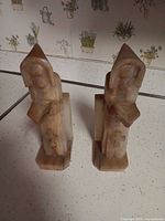 Front angled view of both marble monk bookends