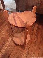 Overall view of wooden heart-shaped two-tier plant stand