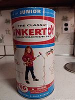 Front view of Tinkertoy Classic Junior Builder cylinder container