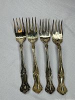 full view of all four matching forks