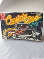 Front of AMT Cruisin USA 1/25 scale 1940 Ford Coupe model kit box showing artwork and branding