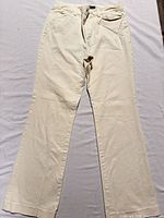 Full view of ivory bootcut trousers front