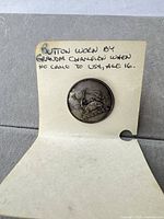 Front view showing stag design on brass button