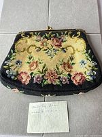 front view of floral needlepoint clutch purse