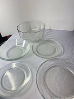 Large mixing bowl with three plates visible