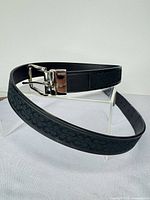 Overall view of Coach black leather & canvas belt with silver buckle