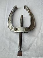 Front view of Craftsman two-jaw puller showing jaws, crossbar and forcing screw