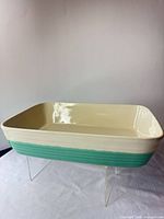 Angle view of rectangular cream and aqua stoneware dish