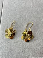 Front view of both gold-tone hibiscus earrings