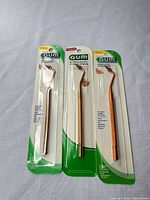 Front view of three sealed GUM Stimulator gum massagers