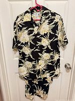 Men’s IOLANI floral Aloha shirt on hanger