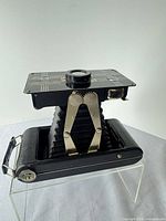 Camera fully extended on stand showing bellows and struts