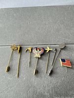 All eight pins lined up on grey surface