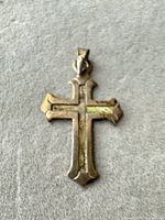 Front view of tarnished silver cross pendant