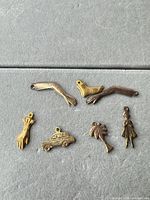 front view of all seven mixed metal charms