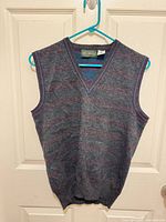 Front view of gray wool sweater vest on hanger