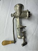 Full view of Puritan 100 meat grinder showing clamp, crank and body