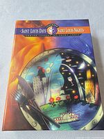 Front cover of Saint Louis Days Saint Louis Nights cookbook showing artwork and title