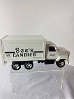 Left side view of See's Candies truck showing logos and overall appearance