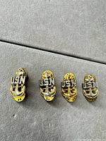 All four USN anchor pins front view