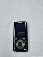Front view of Sony NWZ-E385 showing screen, controls, black finish
