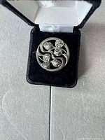 round silver Art Nouveau floral brooch in presentation box