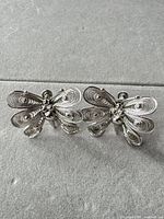 Front view of both sterling silver butterfly filigree earrings