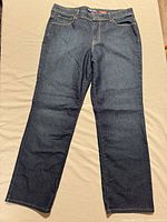 Full view of jeans front showing straight leg cut and dark wash