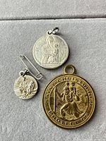 All three medals and safety pin displayed