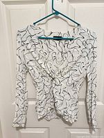 Front view of Topshop abstract print top on hanger