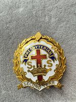 Front view showing enamel design and SECOND YEAR scroll