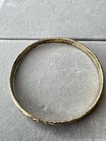 Top view of entire bangle showing circular form and tarnish