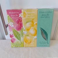 Front view of three sealed Elizabeth Arden Green Tea fragrance boxes