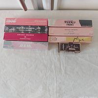 Eight boxed travel perfumes stacked