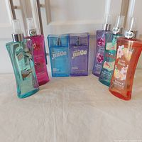 Group shot of all seven body mist bottles