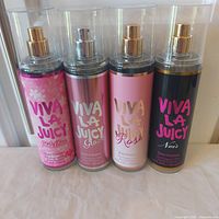 Front view of all four Viva La Juicy fragrance mists