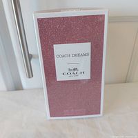 Front view of sealed Coach Dreams box