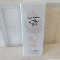 Front of sealed perfume box showing branding and scent.