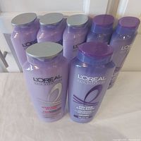 Group shot of all seven L'Oreal shampoo bottles showing front labels