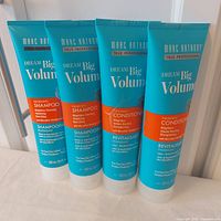 Front view of four Marc Anthony Dream Big Volume tubes (two shampoos, two conditioners)
