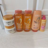 Full lot showing two masks, two shampoos, conditioner, leave-in cream